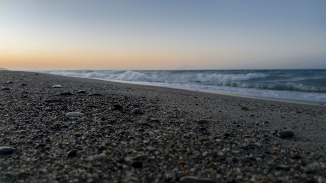 beach_pebbles_sunrise_waves_unsplash