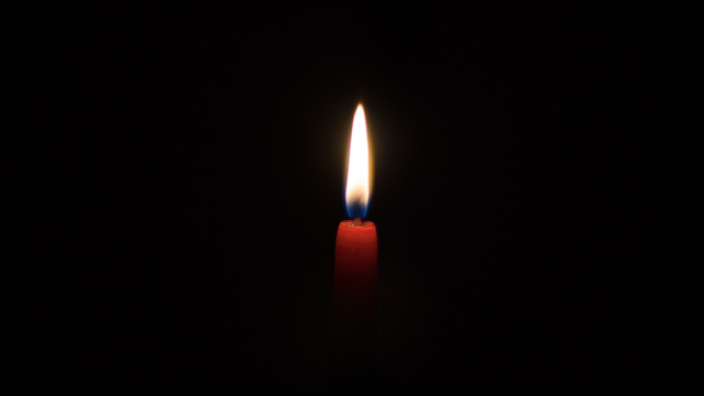 candle_lit_red_darkness_unsplash