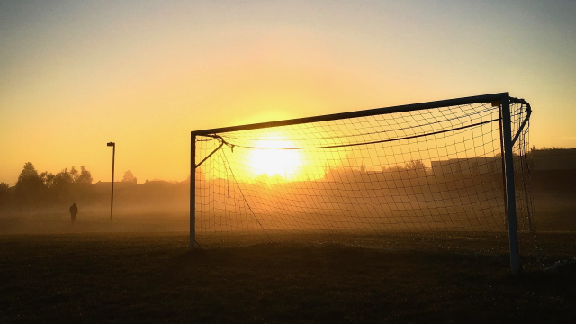 football_goalposts_sunset