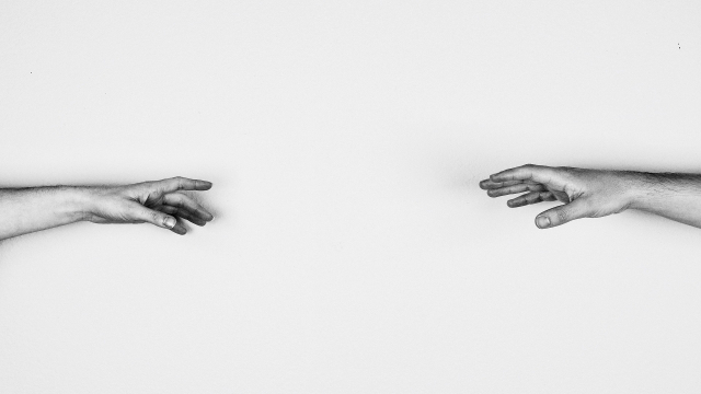 hands_reaching_towards_each_other