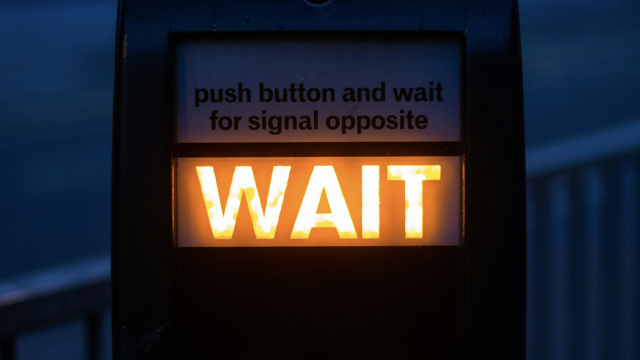 wait_sign_crossing_unsplash