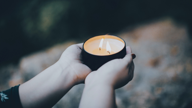 candle_hands_holding_unsplash