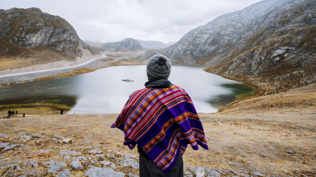 colourful_poncho_hillside_lake_unsplash