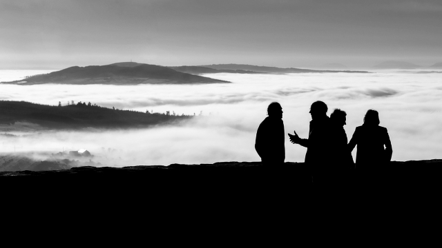 conversation_silhouette_clouds