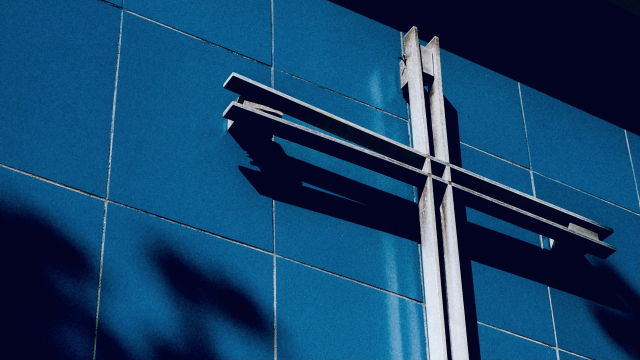 cross_metal_wall_unsplash