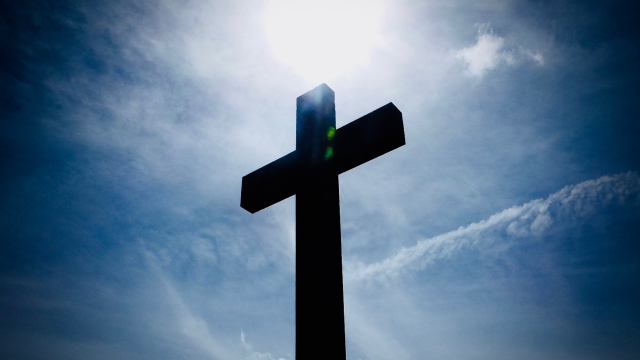 cross_silhouette_sunlight_sky