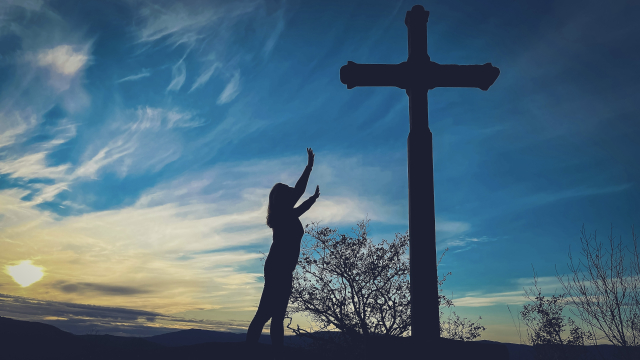 cross_standing_praise_sky_unsplash