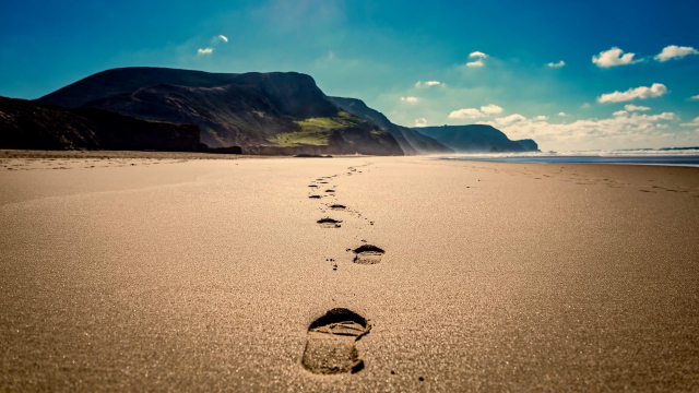 footsteps_beach_clouds