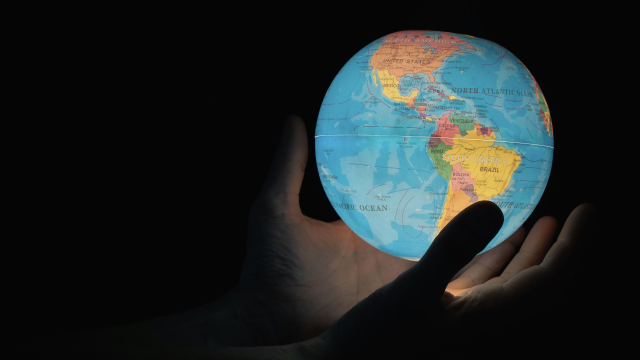 globe_planet_hands_unsplash