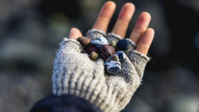 hand_gloves_pebbles_rocks_unsplash