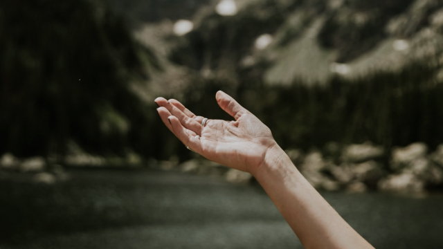 hand_outstretched_open_hills_unsplash