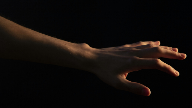 hand_reaching_out_towards_light_unsplash