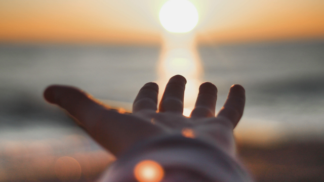 hand_reaching_sunset_unsplash