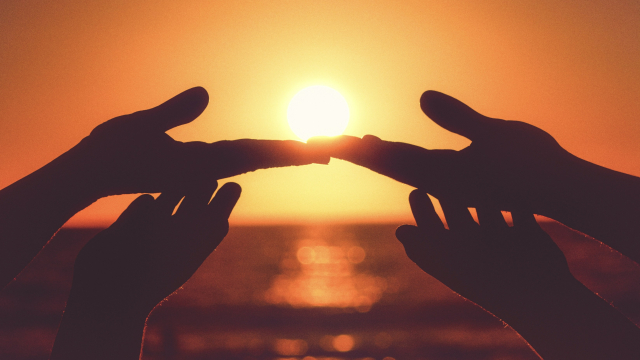 hands_meeting_sunset_sea_unsplash
