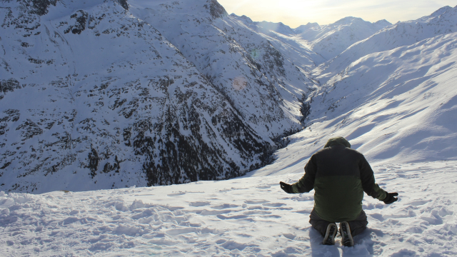 kneeling_mountains_snow_prayer_unsplash