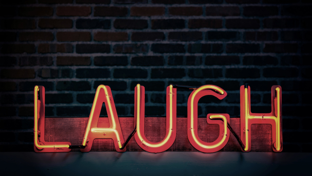 laugh_sign_neon_bricks_unsplash
