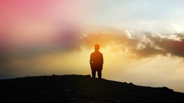 man_silhouette_sunset_hill