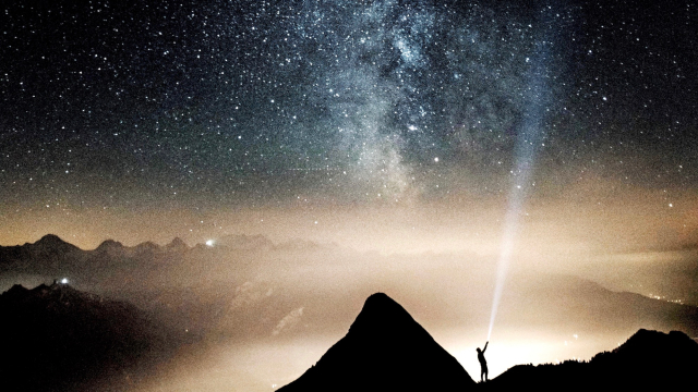 man_torch_stars_mountain_unsplash