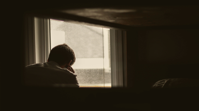 man_window_sad_unsplash