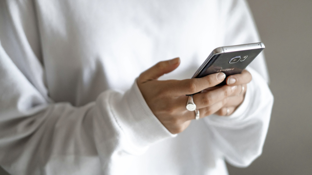 person_texting_phone_message_unsplash