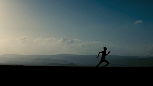 running_silhouette_landscape