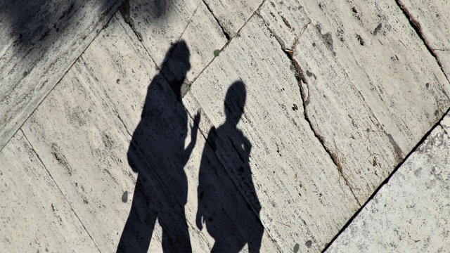 shadow_pair_walking_pavement_unsplash