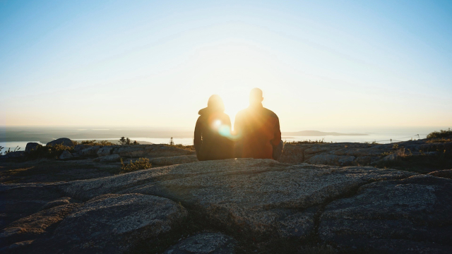 sitting_pair_rocks_sunlight