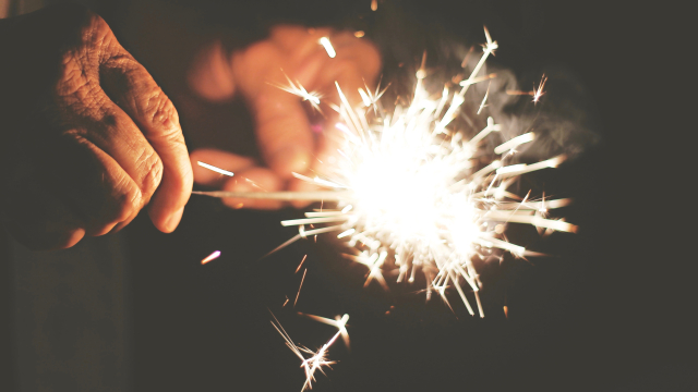 sparkler_light_hands_dark_unsplash