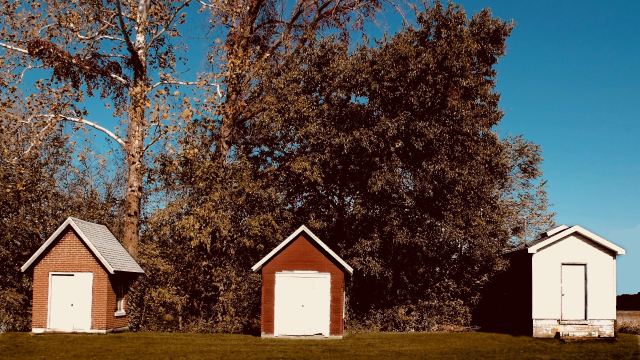 three_small_cabins_trees