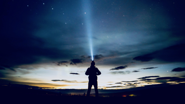 torch_silhouette_nightsky_stars_unsplash