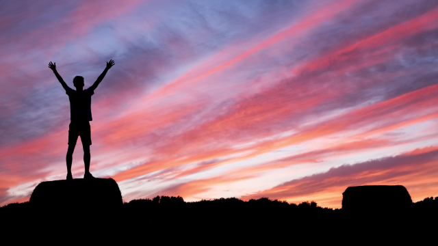 triumphant_silhouette_clouds_sunset_unsplash