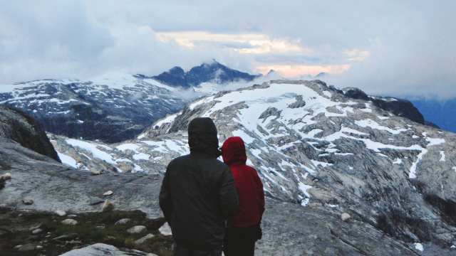 two_figures_mountains_jackets_unsplash