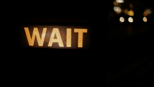 wait_sign_illuminated_unsplash