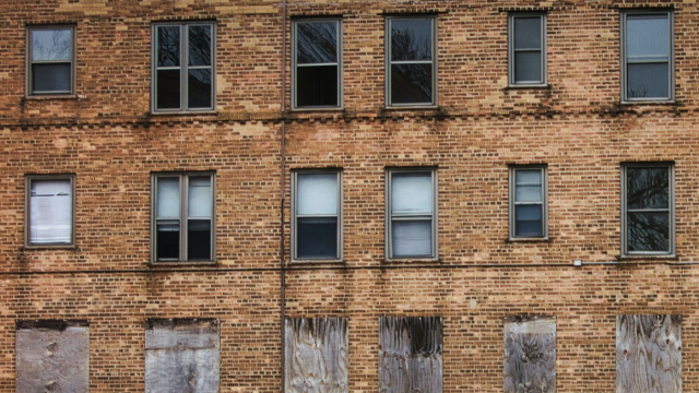 windows_boarded_brick_building_unsplash