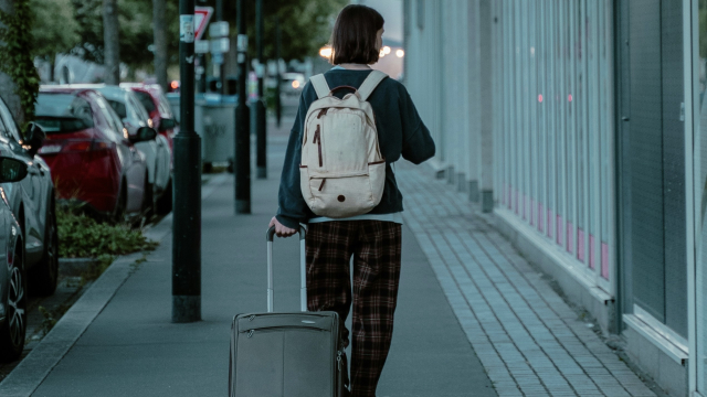 woman_suitcase_backpack_unsplash