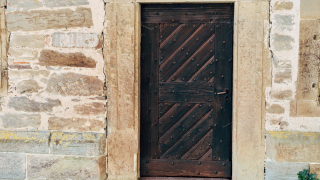 wooden_door_stone_wall_unsplash